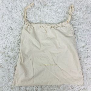 KATHERINE KELLY cream draw string golden dust bag